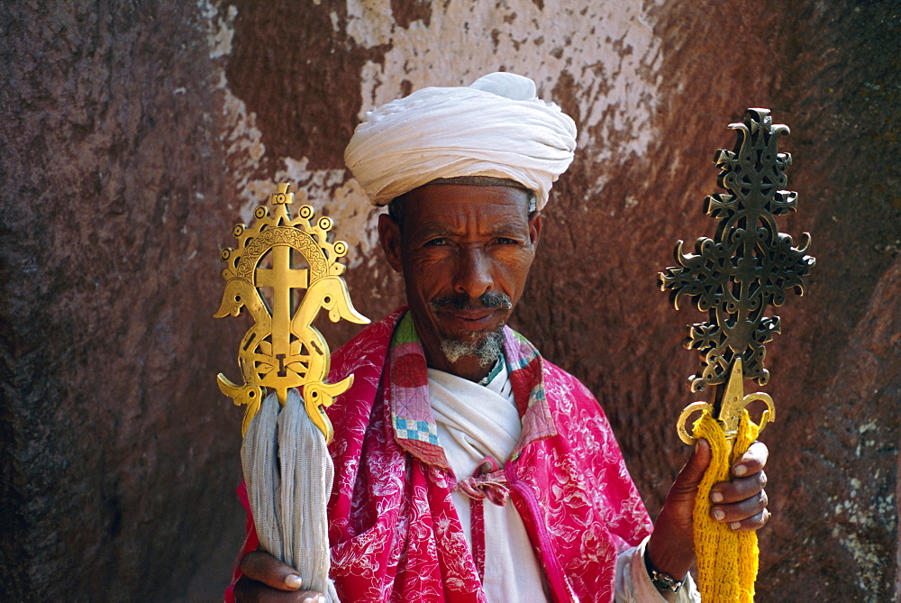 Portrait of a man holding Christian symbols, Gabriel and Raphael, Bieta Mercurios, Lalibela, Wollo region, Ethiopia, Africa