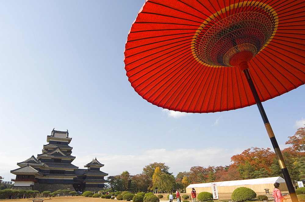 Matsumoto Castle under red parasol, Nagano prefecture, Kyoto, Japan, Asia