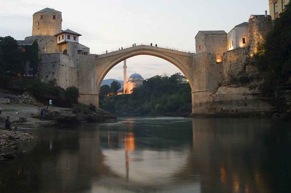 Stari Most Peace Bridge and reflection of mosque on Neretva River, Mostar, Bosnia, Bosnia-Herzegovina, Europe