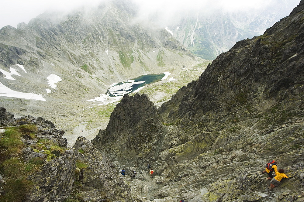 Hikers on trail, High Tatras Mountains (Vyoske Tatry), Tatra National Park, Slovakia, Europe