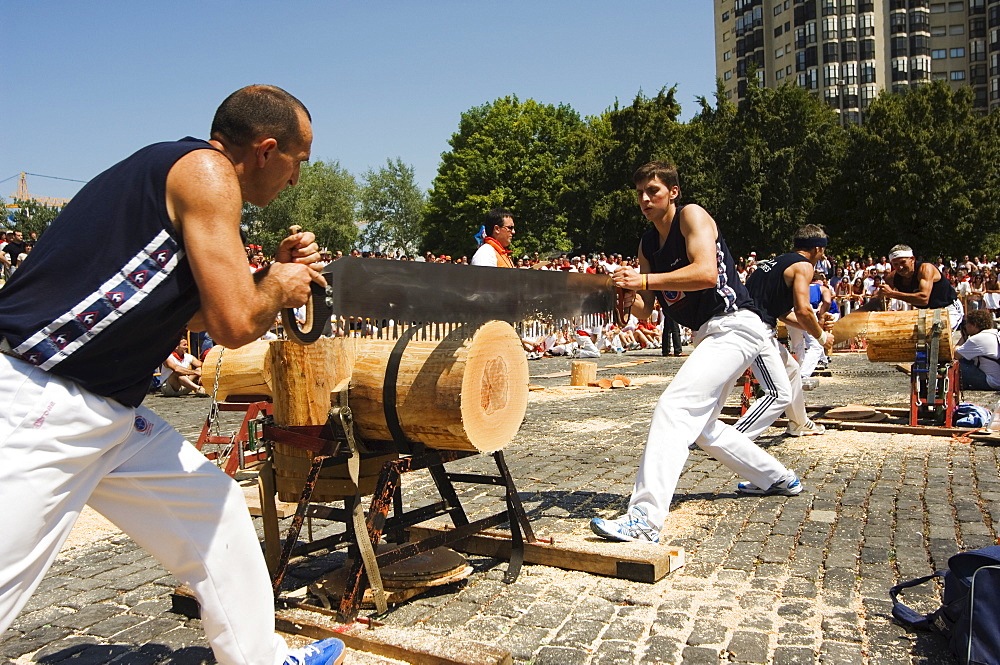 Log cutting strong man competition, during San Fermin, Running of the Bulls Festival, Pamplona, Navarra, Euskadi, Spain, Europe