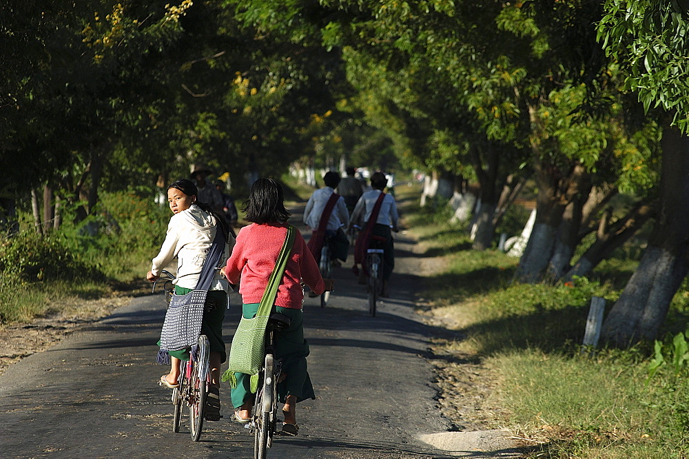 Cycling to school, Inle Lake,Shan State, Myanmar (Burma), Asia