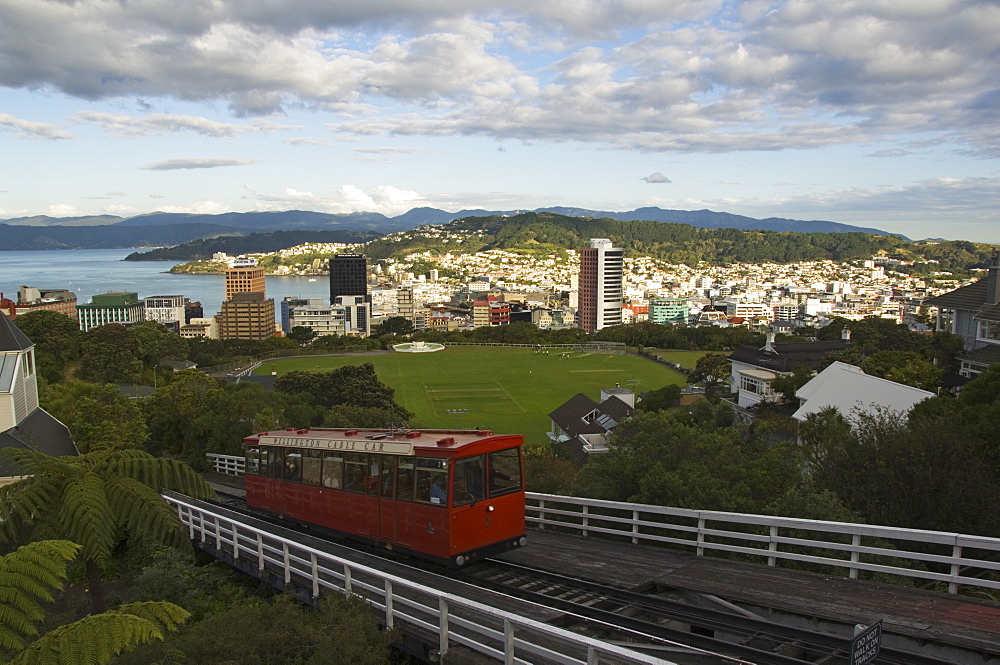 Wellington cable car carrying tourists and commuters up to Mount Victoria and the Botanic Gardens which overlook the city centre and Oriental Bay, Wellington, North Island, New Zealand, Pacific