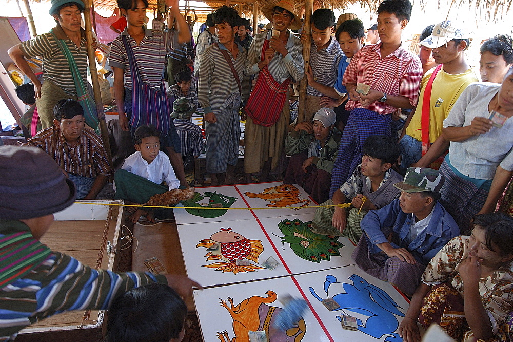 Gambling on market day, Nampan market, Inle Lake, Shan State, Myanmar (Burma), Asia