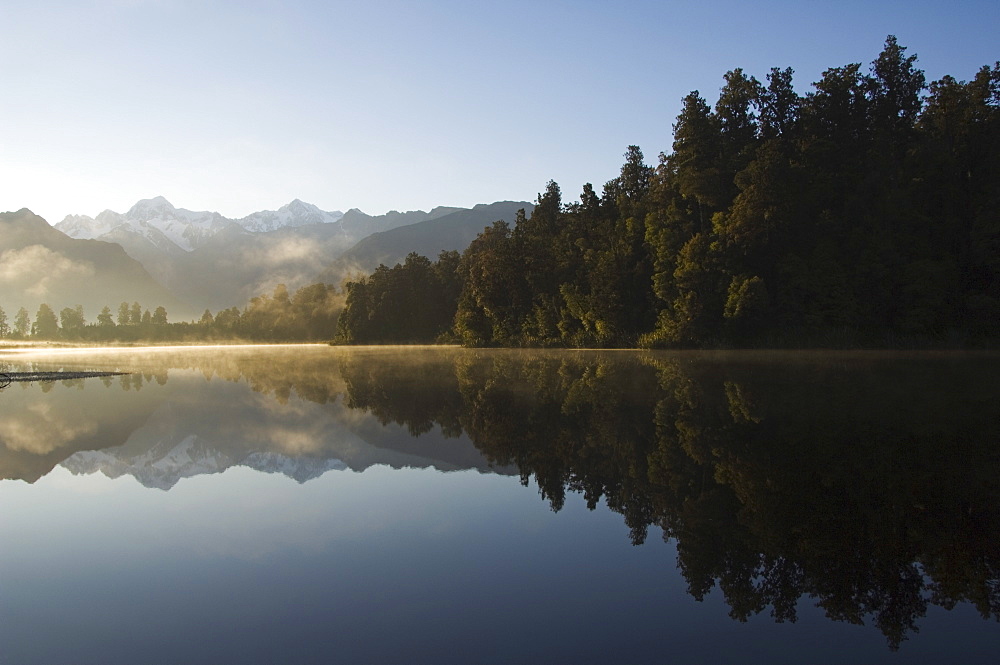 Lake Matheson reflecting a near perfect image of Mount Tasman and Aoraki (Mount Cook), 3754m, Australasia's highest mountain, Southern Alps, South Island New Zealand, Pacific