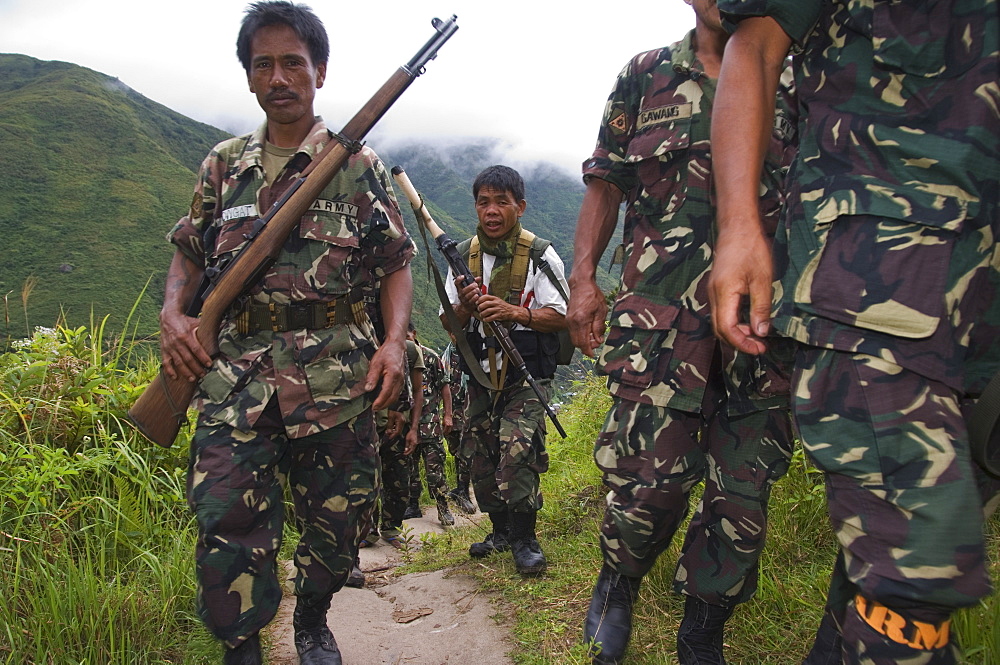 Philippine Army personnel hiking on trail near Tinglayan, The Cordillera Mountains, Kalinga Province, Luzon, Philippines, Southeast Asia, Asia