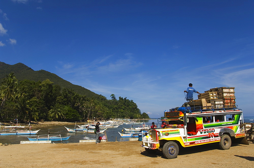 Colouful jeepney loading up at fishing boat harbour, Sabang Town, Palawan, Philippines, Southeast Asia, Asia