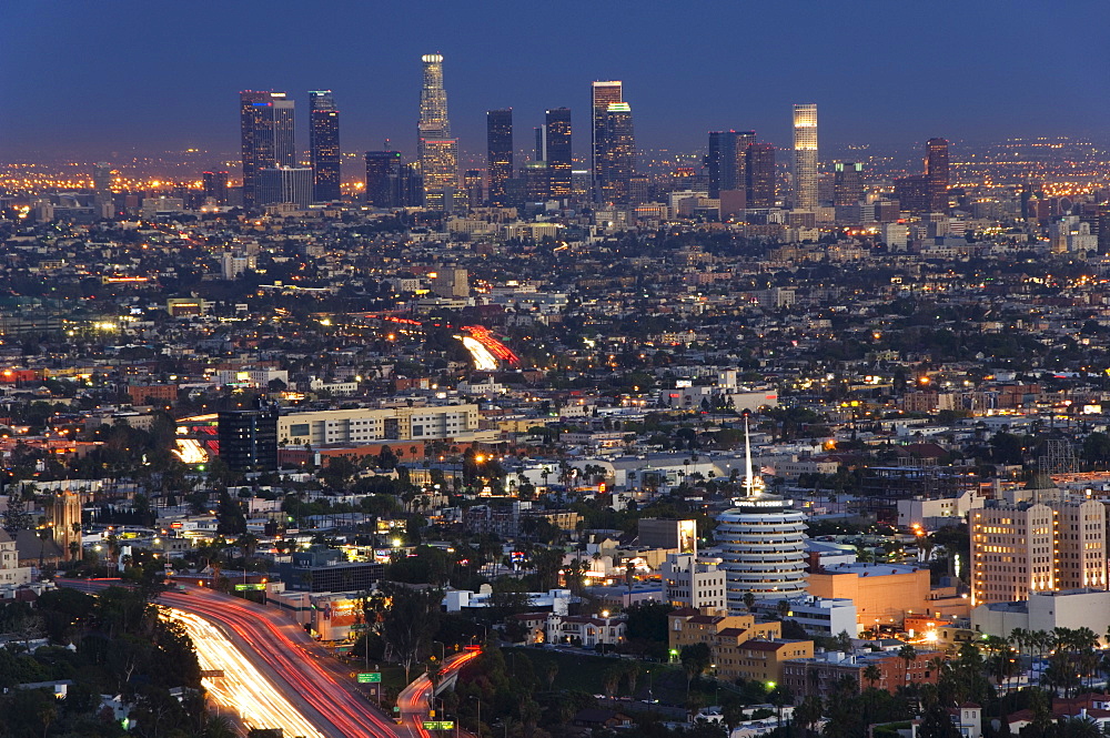 Downtown district skyscrapers and car lights on a city highway, Los Angeles, California, United States of America, North America