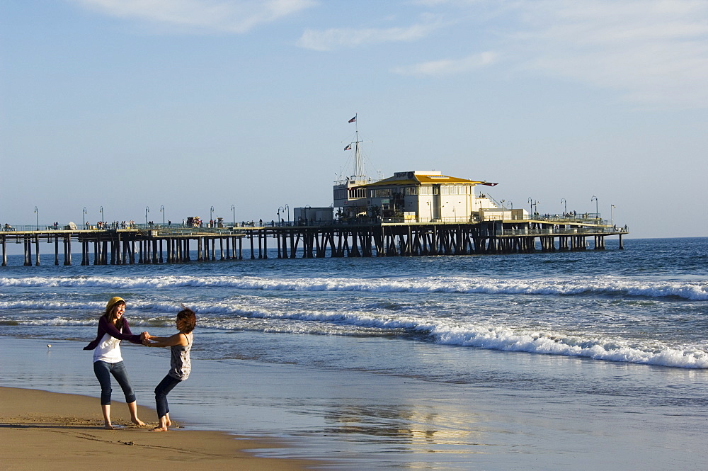 Girls enjoying the seaside near Santa Monica Pier, Santa Monica Beach, Los Angeles, California, United States of America, North America