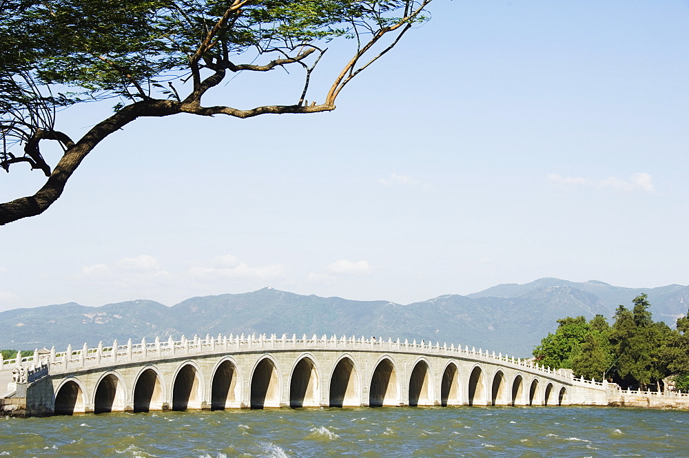 Seventeen Arch Bridge on Kunming Lake built in 1750 during Emperor Qialong's reign leads to South Lake Island, Yihe Yuan (The Summer Palace), UNESCO World Heritage Site, Beijing, China, Asia