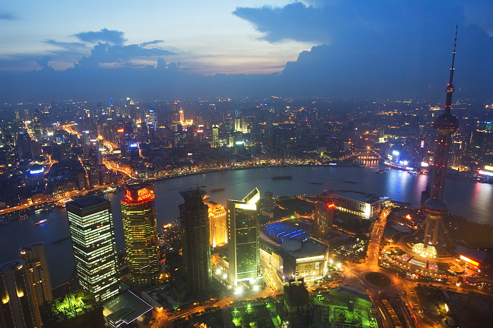 Car light trails on the Bund and The Oriental Pearl Tower illuminated in Pudong new area, Pudong, Shanghai, China, Asia