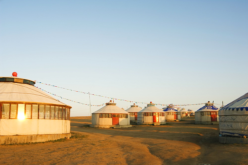 Sunrise on nomad yurt tents, Xilamuren grasslands, Inner Mongolia province, China, Asia