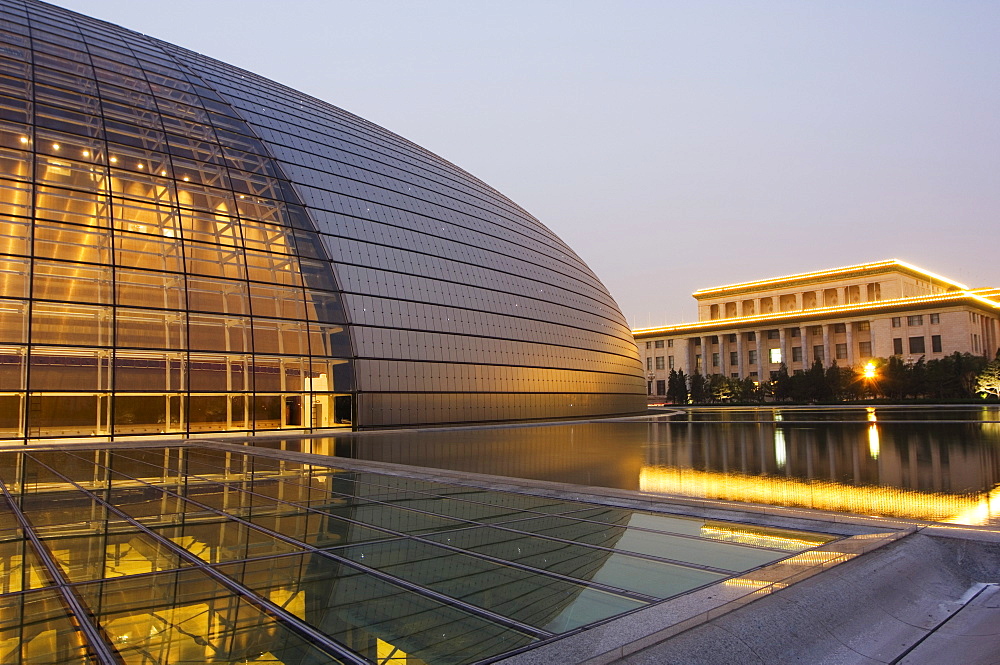 Soviet style Great Hall of the People contrasts with The National Theatre Opera House, also known as The Egg designed by French architect Paul Andreu and made with glass and titanium opened 2007, Beijing, China, Asia