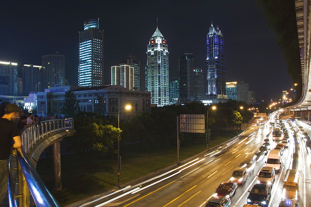 Car light trails and illuminated buildings on Peoples Square, Shanghai, China, Asia