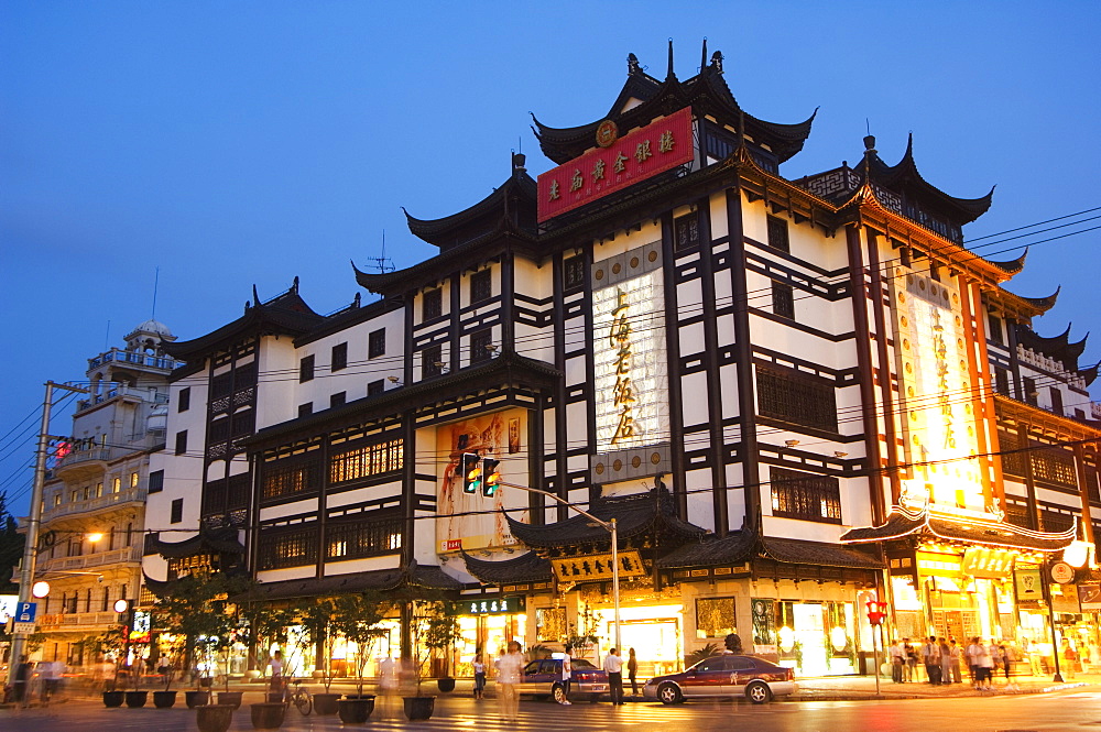 Yuyuan (Yu yuan) Garden Bazaar buildings founded by Ming dynasty Pan family illuminated in the Old Chinese city district, Shanghai, China, Asia