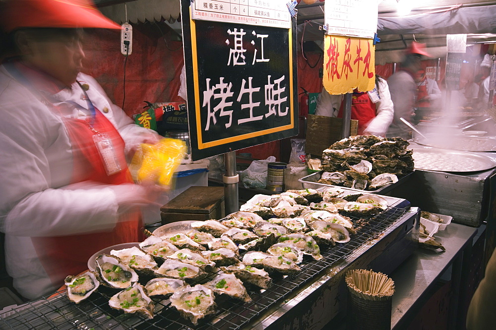 Street market selling oysters in Wanfujing shopping street, Beijing, China, Asia