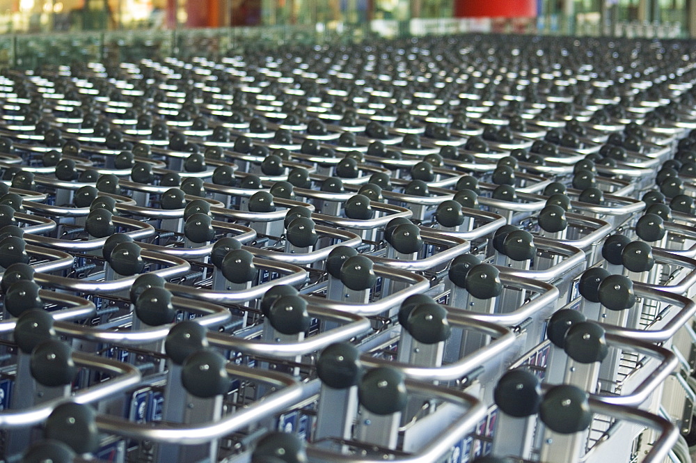 Hundreds of trolleys at Beijing Capital Airport, part of the new Terminal 3 building opened February 2008, second largest building in the world, Beijing, China, Asia