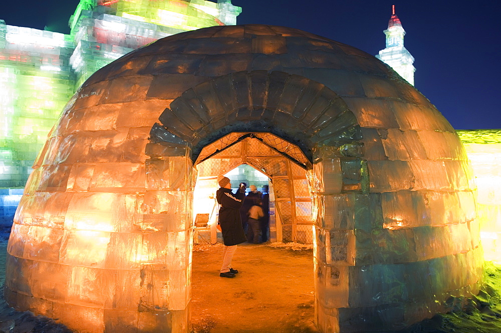 An igloo ice sculpture illuminated at night at the Ice Lantern Festival, Harbin, Heilongjiang Province, Northeast China, China, Asia