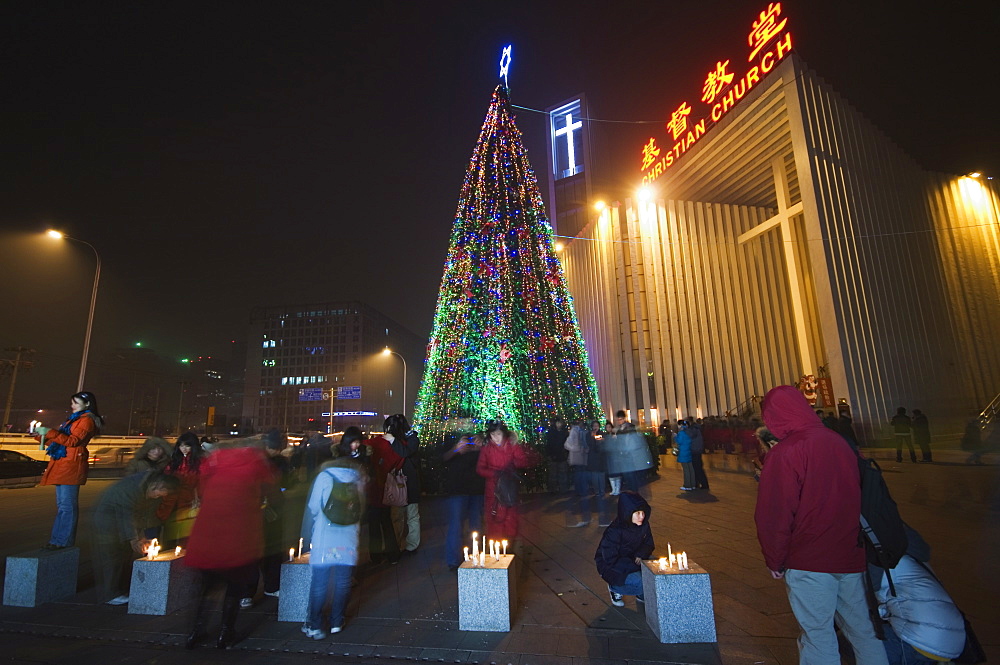 Night time illuminations of a Christmas tree and decorations at a Christian church celebrating in Beijing, China, Asia