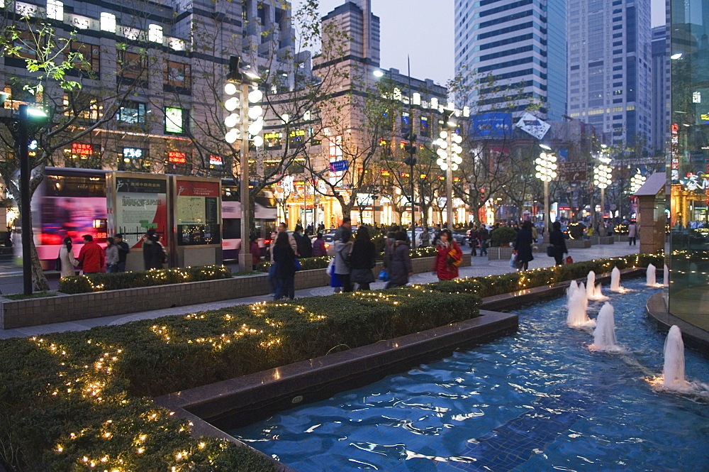 Modern displays and illuminations around a fountain in the French Concession area, Shanghai, China, Asia