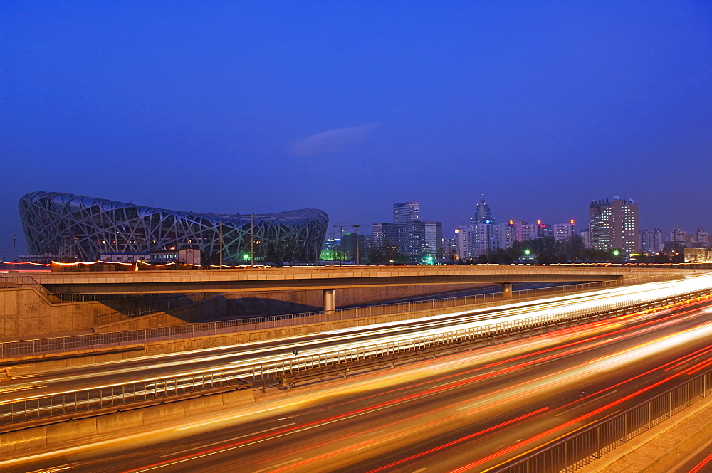 Car light trails at the National Stadium, 2008 Beijing Olympic venue, Beijing, China, Asia