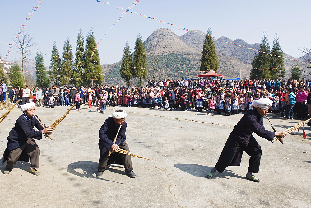 Men playing the lusheng at a 4 Seals Miao lunar New Year festival, Xinyao village, Guizhou Province, China, Asia