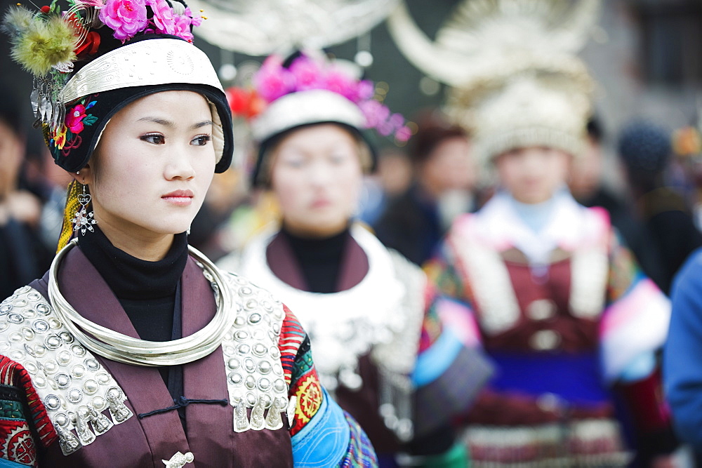 Women in ethnic costume at a Lunar New Year festival in the Miao village of Qingman, Guizhou Province, China, Asia