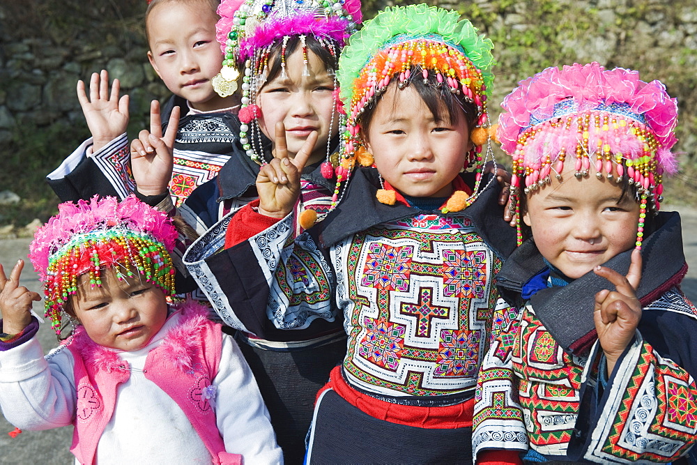 Girls in ethnic costume at a 4 Seals Miao lunar New Year festival, Xinyao village, Guizhou Province, China, Asia