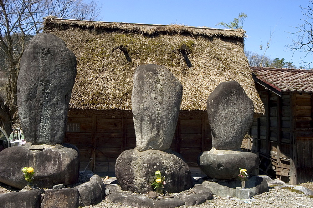 Stone monuments, Gasshou zukuri thatched roof houses, Shirokawago, Ogimachi, Gifu prefecture, Honshu island, Japan, Asia