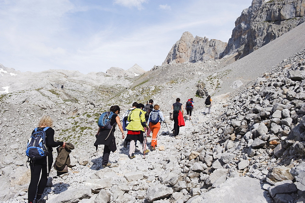 Hikers in Picos de Europa National Park, shared by the provinces of Asturias, Cantabria and Leon, Spain, Europe