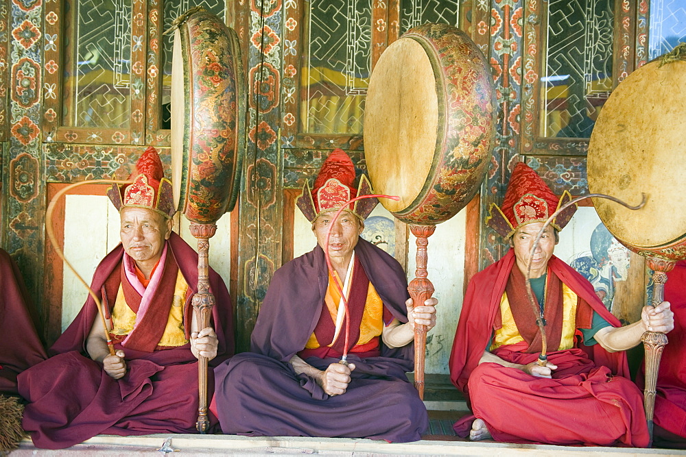 Monks playing drums at a Tsechu (festiva), Gangtey Gompa (Monastery), Phobjikha Valley, Bhutan, Asia