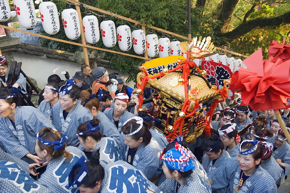 Women carrying a mikoshi portable shrine at Hadaka Matsuri (Naked Festival), Hofu city, Yamaguchi Prefecture, Japan, Asia