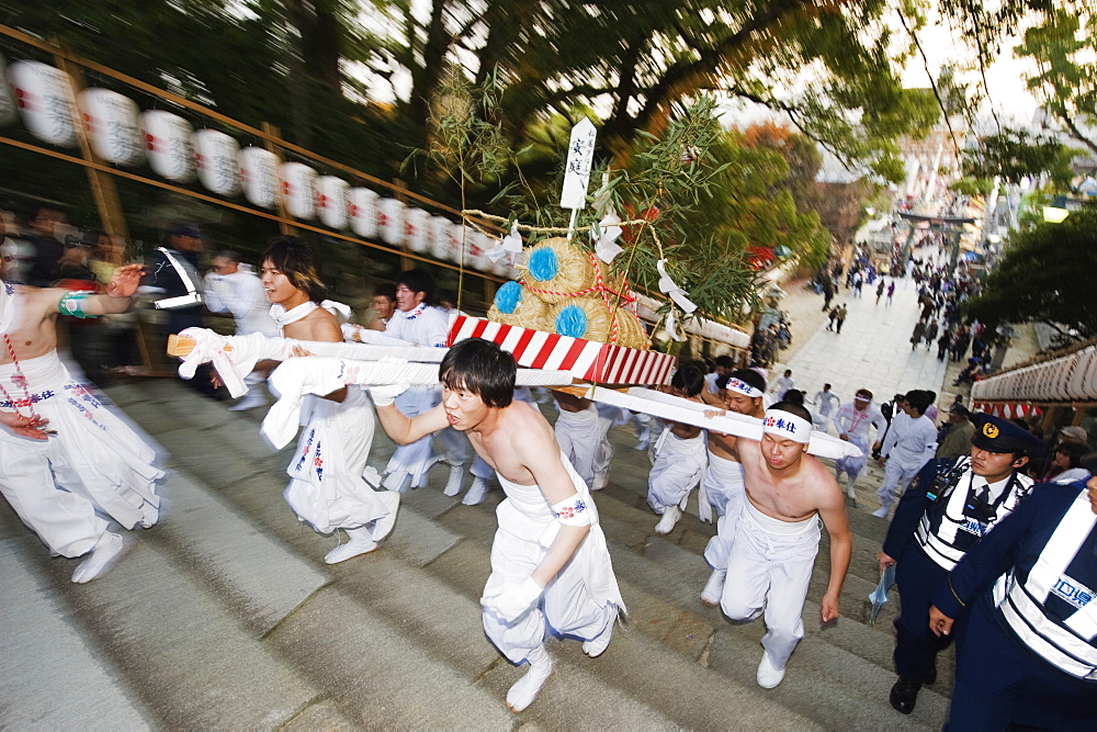 Rice bales being carried at Hadaka Matsuri (Naked Festival), Hofu city, Yamaguchi Prefecture, Japan, Asia