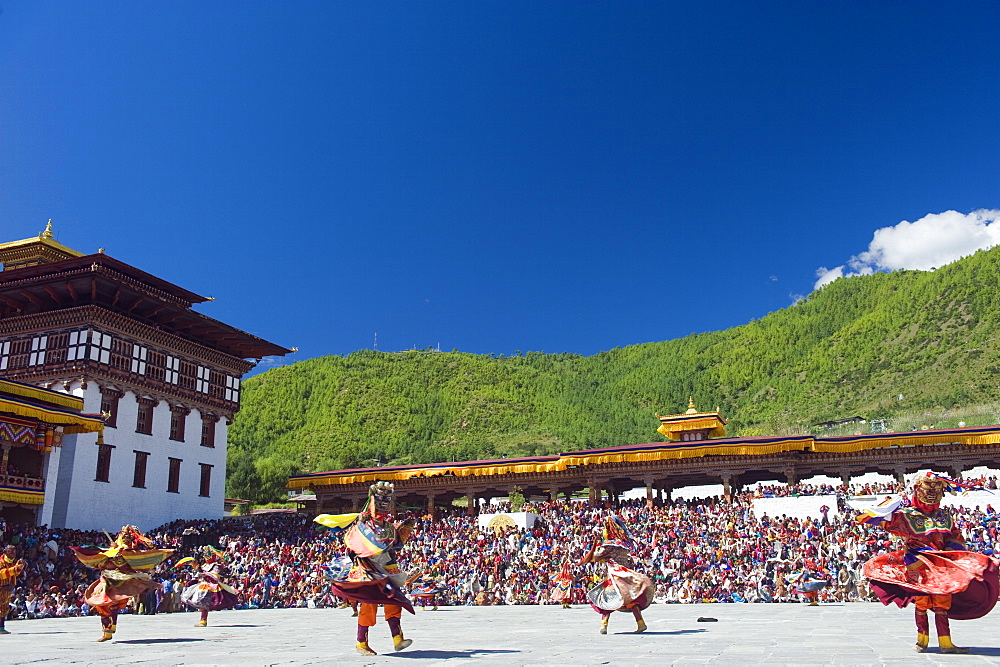 Dancers in traditional costume, Autumn Tsechu (festival) at Trashi Chhoe Dzong, Thimpu, Bhutan, Asia