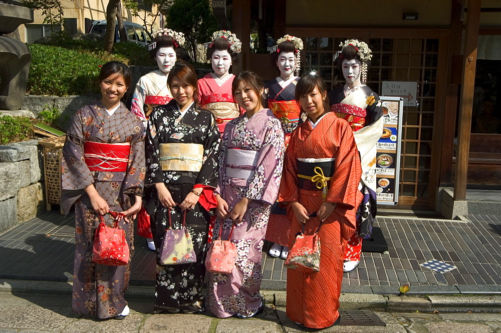 Girls wearing yukata - kimono, geisha, maiko (trainee geisha) in Gion, Kyoto city, Honshu, Japan, Asia