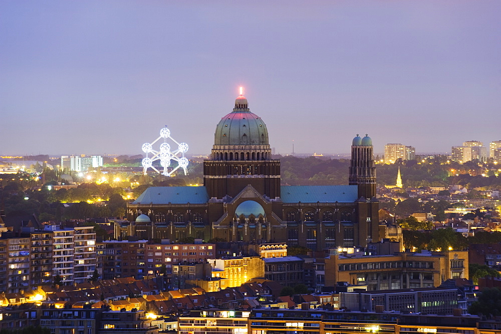 National Catholic Church and Atomium, panoramic view of the city illuminated at night, Brussels, Belgium, Europe