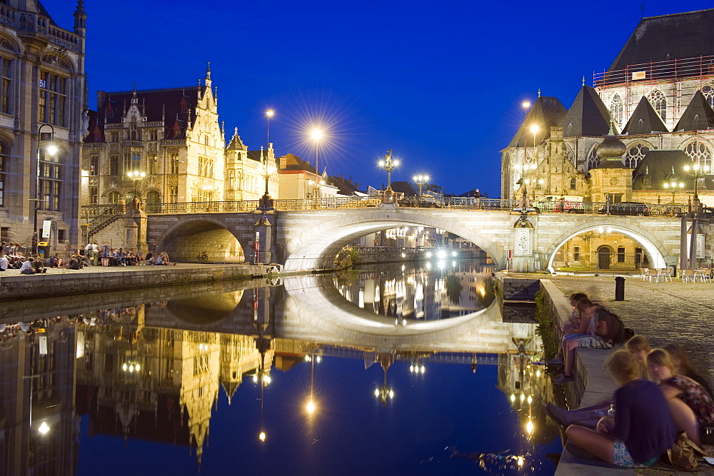 Reflection of arched bridge and waterfront town houses, Ghent, Flanders, Belgium, Europe