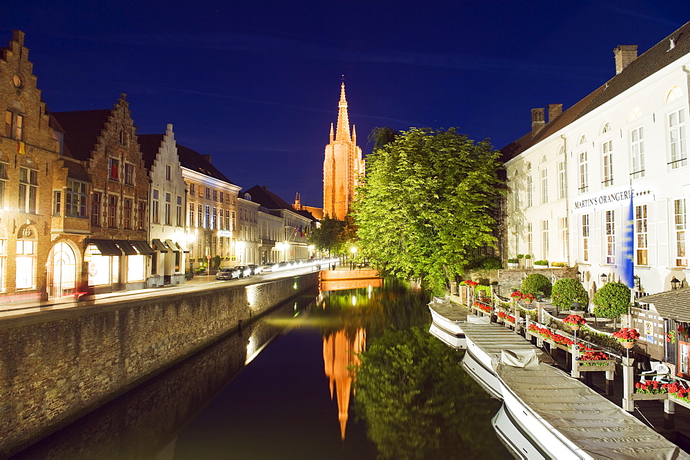 Reflection of Onze Lieve Vrouwekerk (Church of Our Lady), lit up at night, Old Town, UNESCO World Heritage Site, Bruges, Flanders, Belgium, Europe