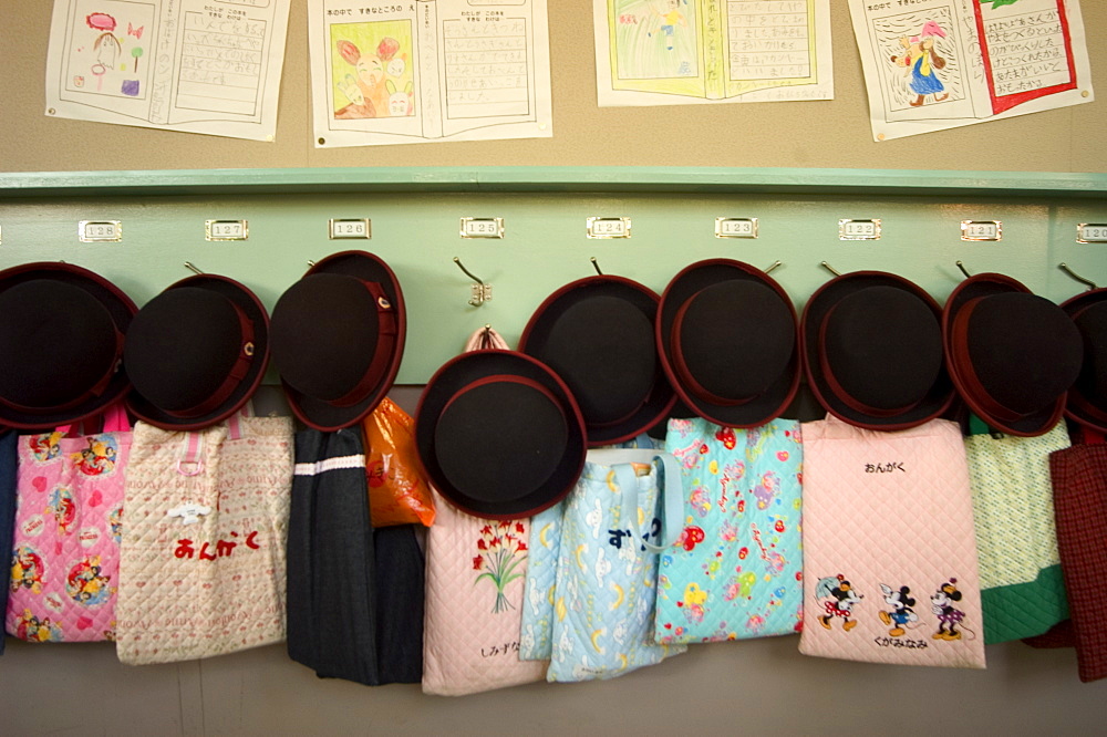 Student hats and bags hanging up, elementary school, Tokyo, Honshu, Japan, Asia