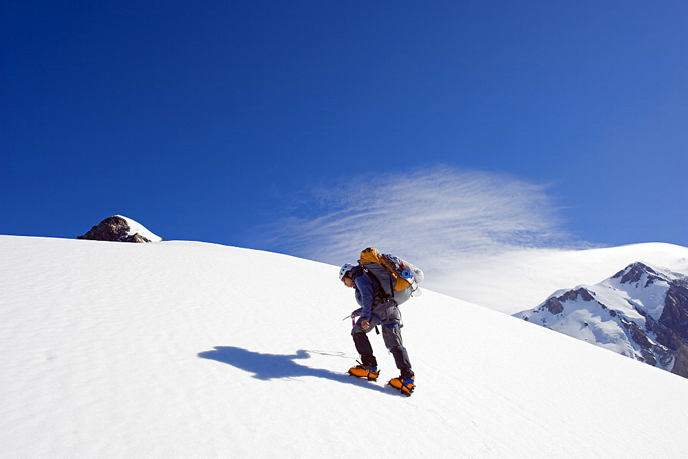 Climber on Aiguille de Bionnassay on the route to Mont Blanc, French Alps, France, Europe