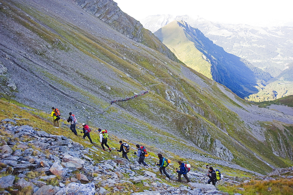 Hikers and climbers from the first train of the day leaving for Mont Blanc, French Alps, France, Europe