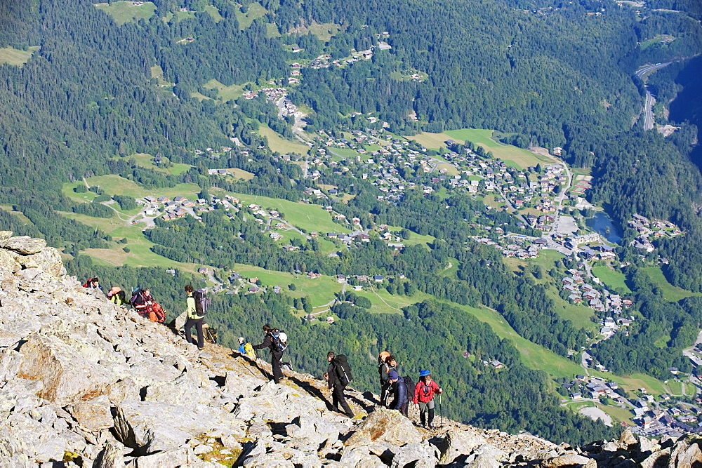 Hikers above Chamonix Valley, Mont Blanc Massif, French Alps, France, Europe