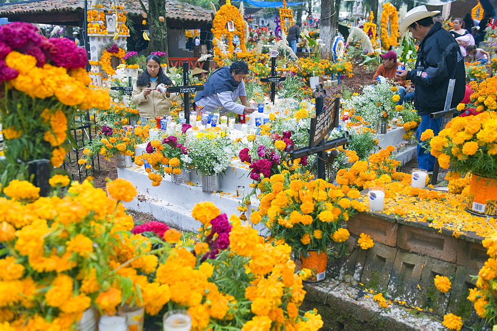 A flower covered grave, Dia de Muertos (Day of the Dead) celebrations in a cemetery in Tzintzuntzan, Lago de Patzcuaro, Michoacan state, Mexico, North America