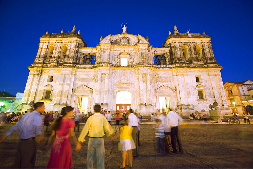 People dancing outside Leon Cathedral, Basilica de la Asuncion, Leon, Nicaragua, Central America