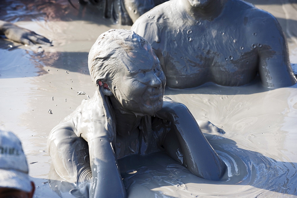 Tourists bathing in mud bath, Volcan de Lodo El Totumo, Mud Volcano, Colombia, South America