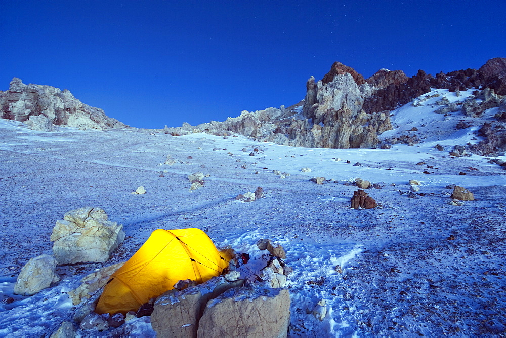 Illuminated tent at White Rocks campsite, Piedras Blancas, 6200m, Aconcagua 6962m, highest peak in South America, Aconcagua Provincial Park, Andes mountains, Argentina, South America