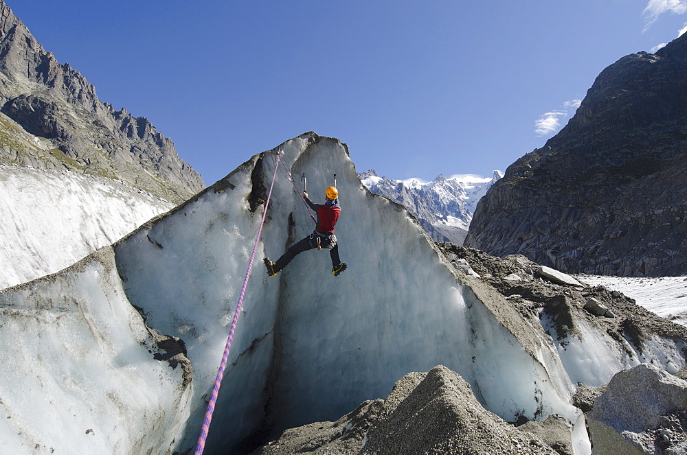 Ice climber at Mer de Glace glacier, Chamonix, Haute-Savoie, French Alps, France, Europe 