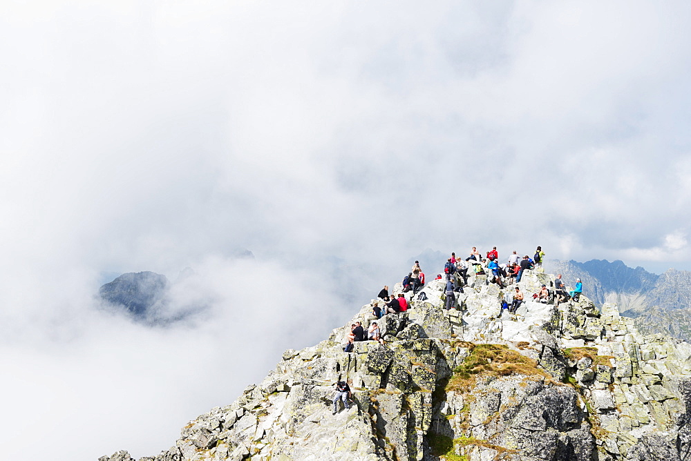 Hikers on summit of Mount Rysy, 2499m, the highest point in Poland, Zakopane, Carpathian Mountains, Poland, Europe 