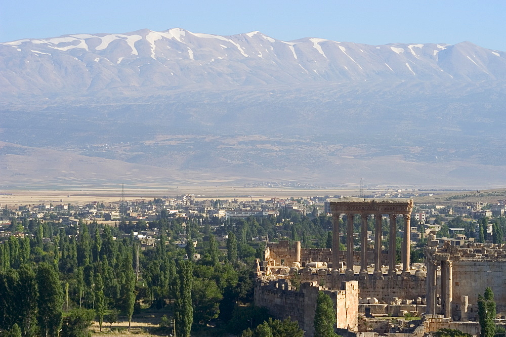 Snow capped mountains of the Anti-Lebanon Range behind the Roman archaeological site, Baalbek, UNESCO World Heritage Site, The Bekaa Valley, Lebanon, Middle East