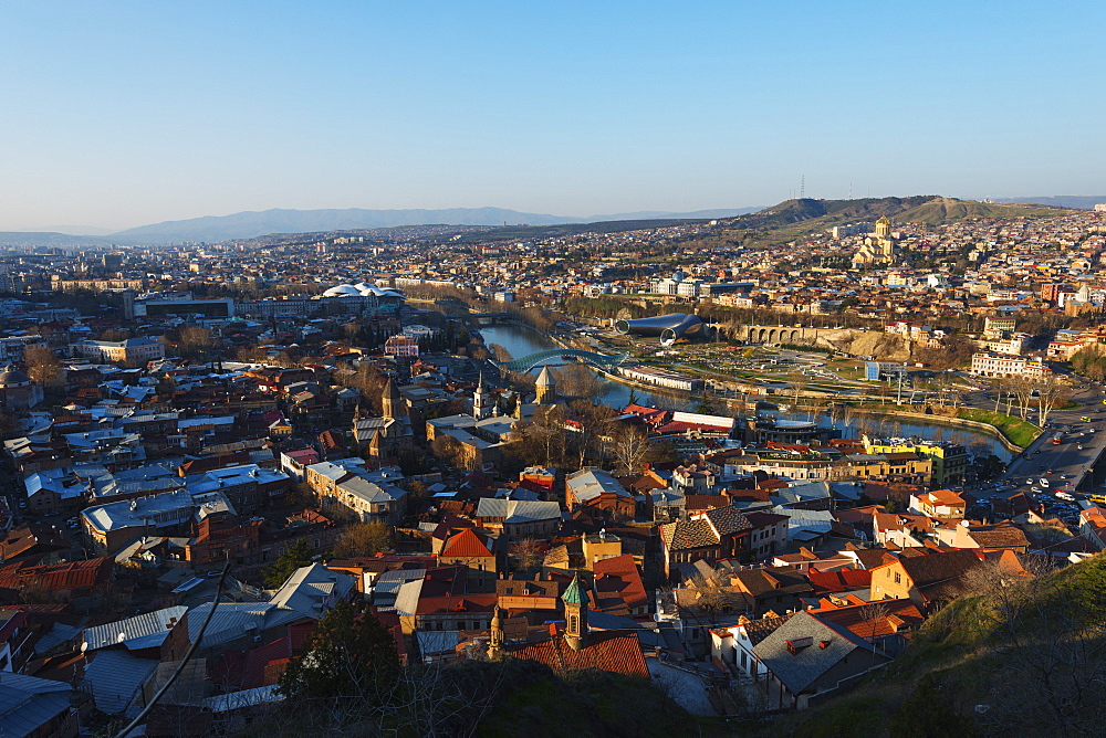 City view including Bridge of Peace on Mtkvari river, Tbilisi Sameda Cathedral and Presidential Palace, Tbilisi, Georgia, Caucasus, Central Asia, Asia